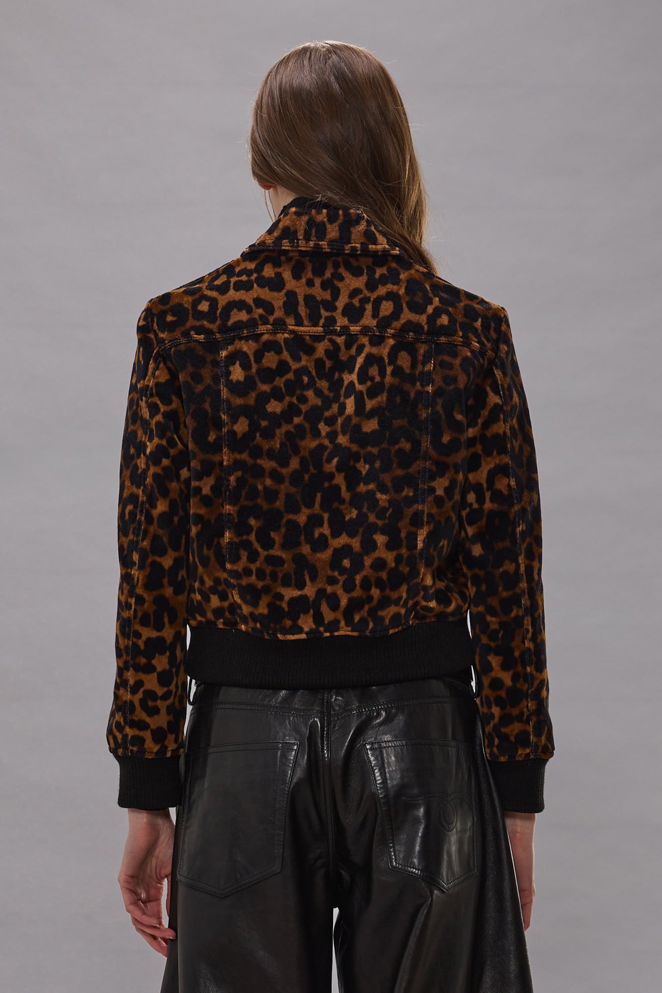 Brown and black leopard print cropped jacket with collar and black ribbed cuffs, shown from back view.